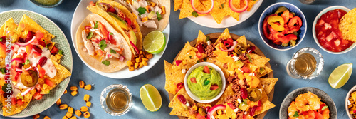 Mexican food and drink panorama, overhead flat lay panoramic shot of nachos