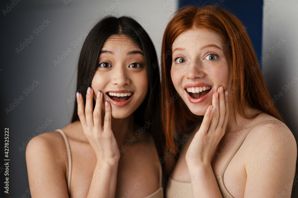Close up studio portrait of two beautiful young girls Close up studio portrait of two beautiful young girls