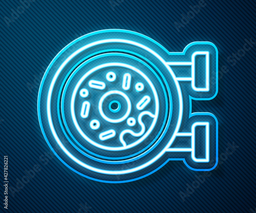 Glowing neon line Donut with sweet glaze icon isolated on blue background. Vector