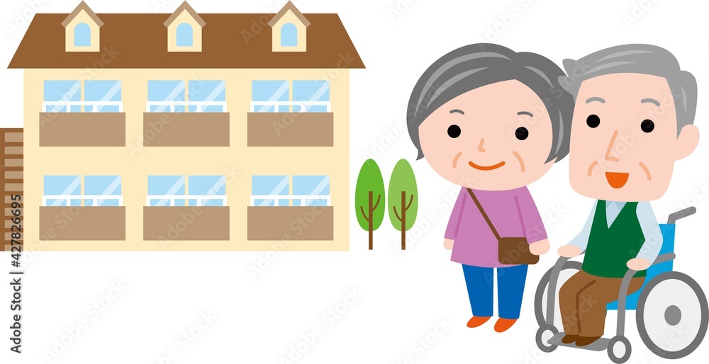 アパートを見る車椅子の高齢夫婦