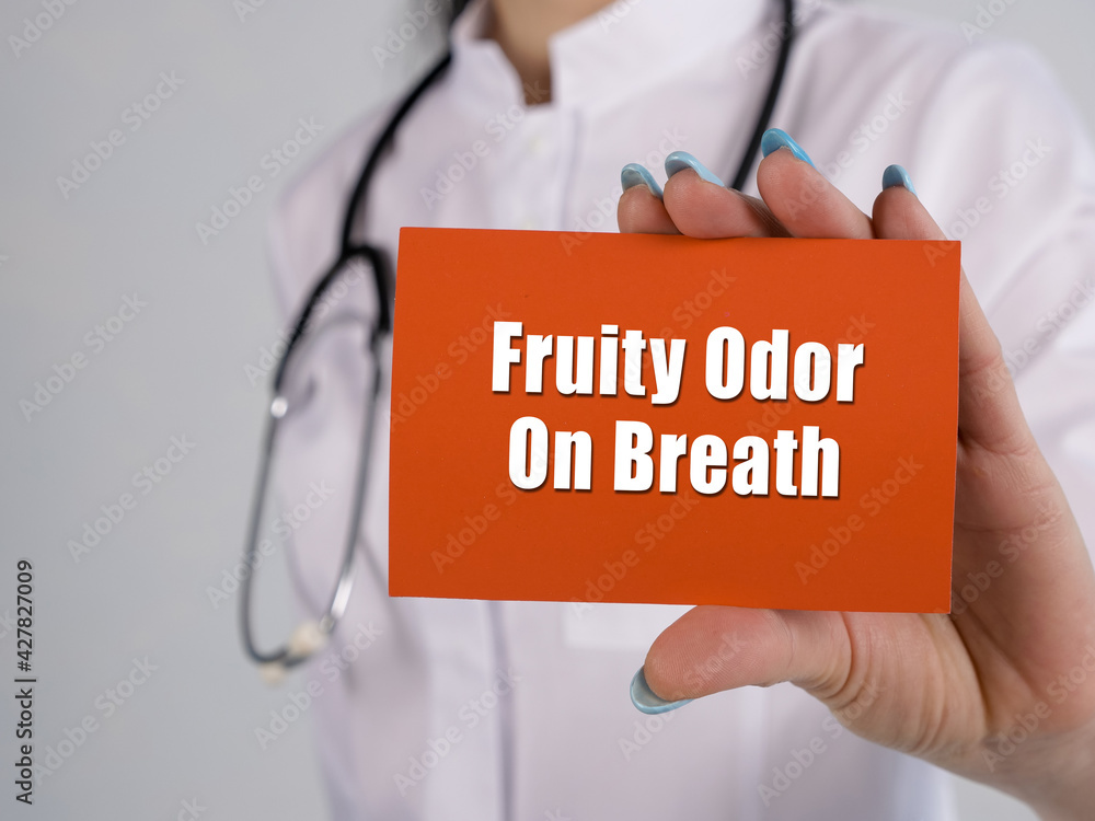 Medical concept about Fruity Odor On Breath with sign on the piece of paper. Medical concept about Fruity Odor On Breath with sign on the piece of paper.