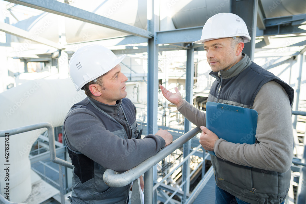 portrait of industrial engineers talking portrait of industrial engineers talking
