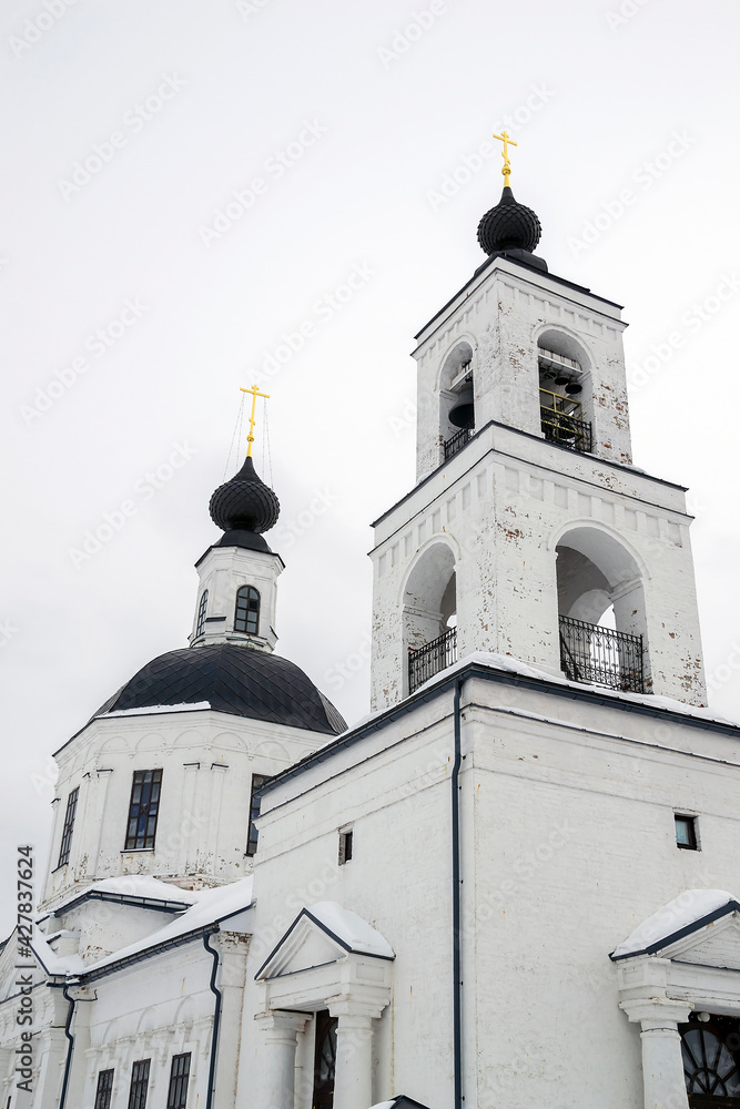 orthodox church made of white brick in winter