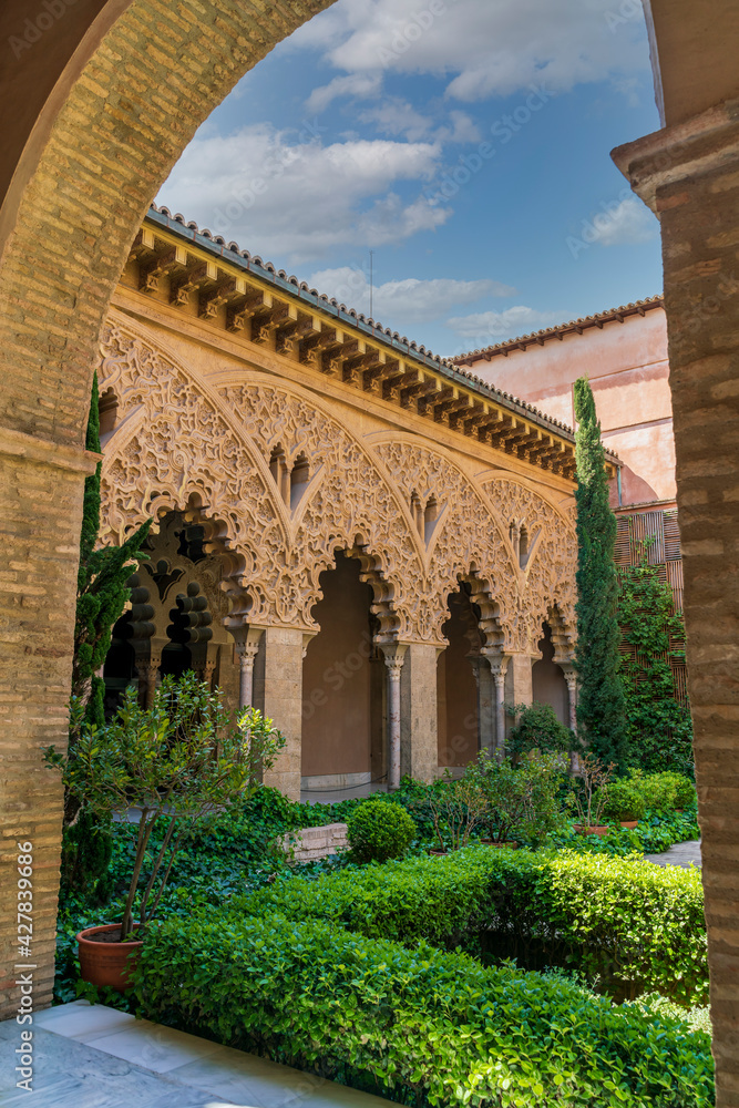 Zaragoza, Aragón, Spain - April 2021: Partial view of the courtyard of Santa Isabel from the Aljafería Palace, seat of the Government of Aragón.