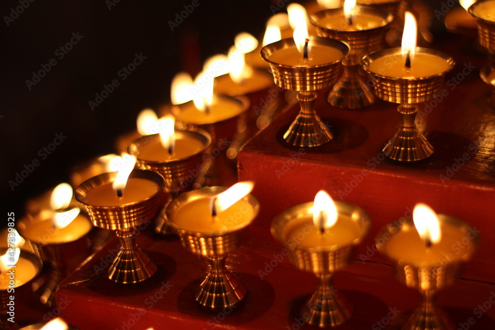 Buddhist Altar Candles at Religious 108 Butter Lamp Festival in Temple Monastery. Beautiful Tranquil Scenic View of Oil Lamps and Swaying Flame for Praying Buddhist Altar Candles at Religious 108 Butter Lamp Festival in Temple Monastery. Beautiful Tranquil Scenic View of Oil Lamps and Swaying Flame for Praying