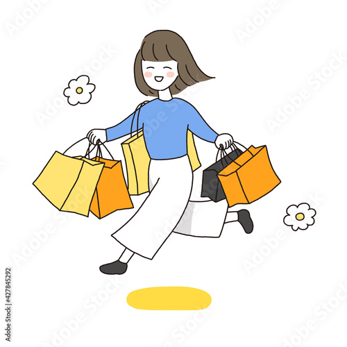 ショッパーを持ってルンルン走っている若い女性