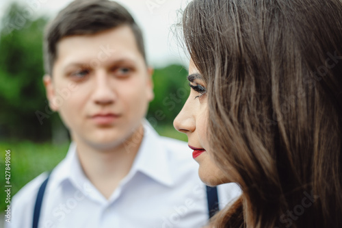 Loving happy couple, man and girl on valentine's day outdoors. Love and relationship between man and woman. Portrait of a couple in love 