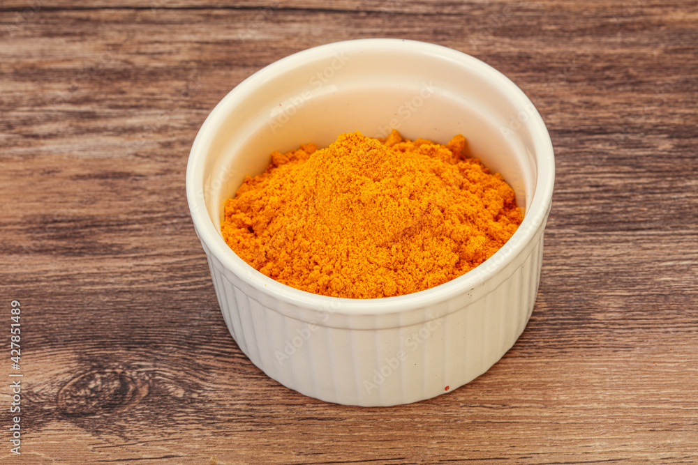 Tumeric powder in the bowl Tumeric powder in the bowl