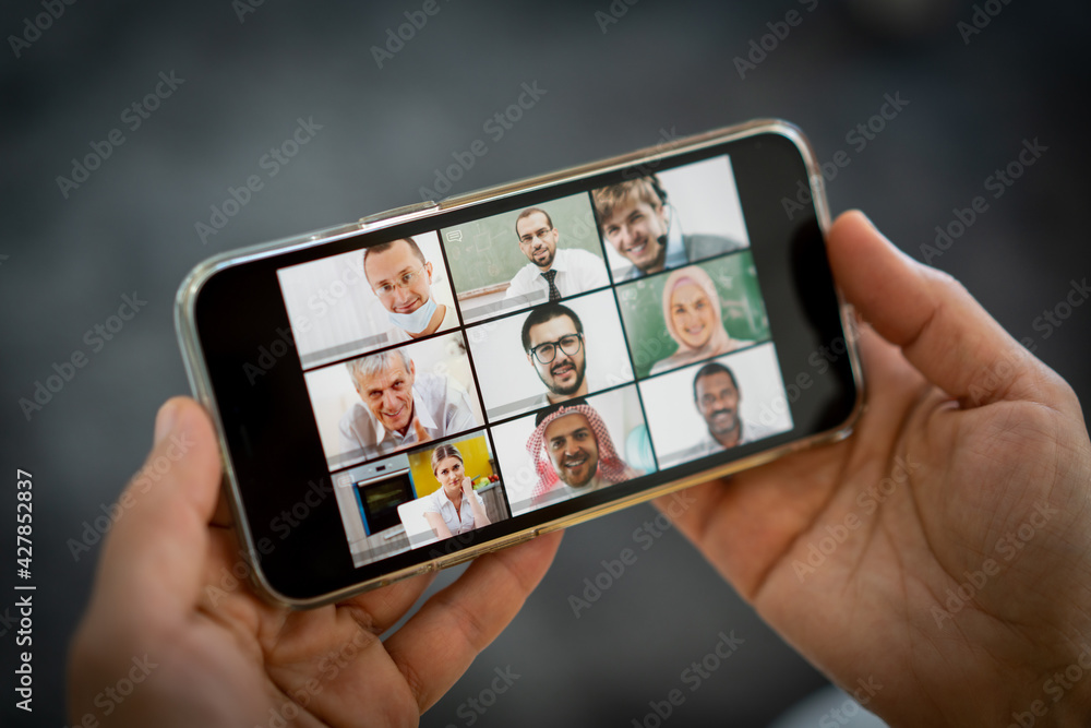 Online business conference screen in hands new normal Online business conference screen in hands new normal