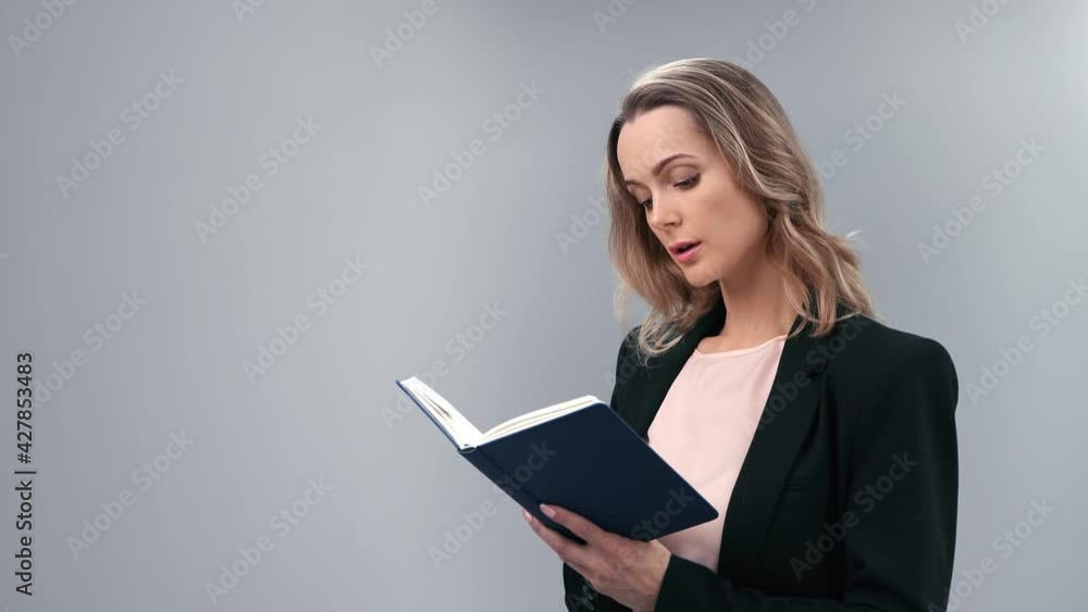 Pensive business woman writing to do list in paper diary use pencil isolated. 4k Dragon RED camera Pensive business woman writing to do list in paper diary use pencil isolated. 4k Dragon RED camera