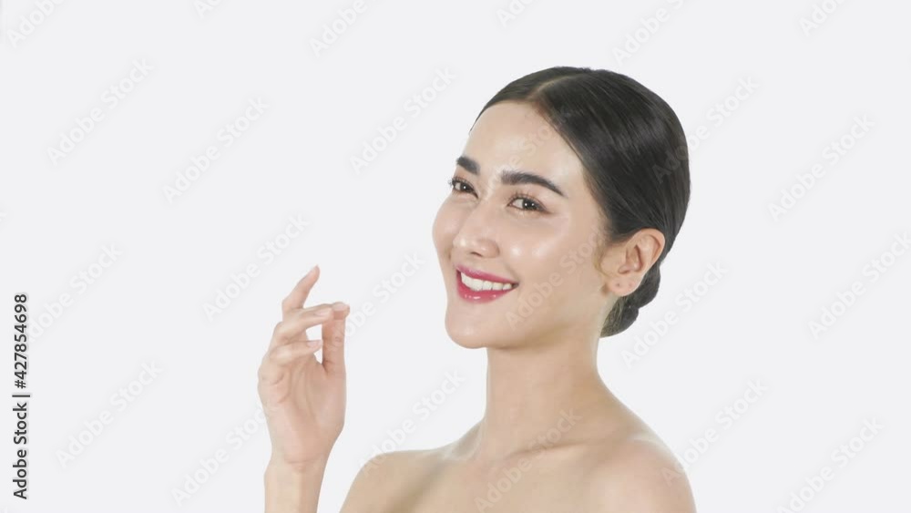 Beauty concept of 4k Resolution. A young Asian woman enjoying a refreshing face on a white background. Beauty concept of 4k Resolution. A young Asian woman enjoying a refreshing face on a white background.