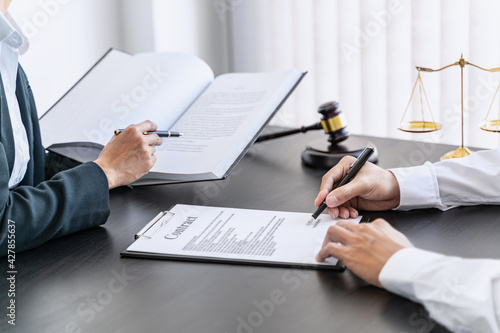 Lawyer discuss the contract and legal document agreement in office. Law and legal concept