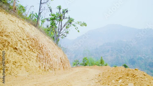 Empty Dirt Road in Nepal Village at hills area  photo