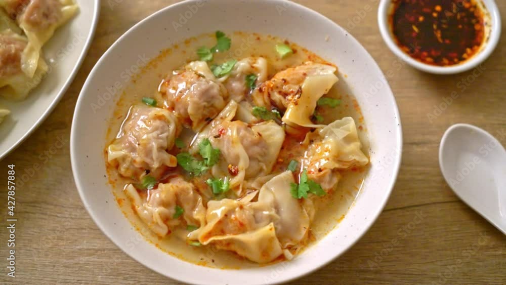 pork wonton soup or pork dumplings soup with roasted chili - Asian food style pork wonton soup or pork dumplings soup with roasted chili - Asian food style