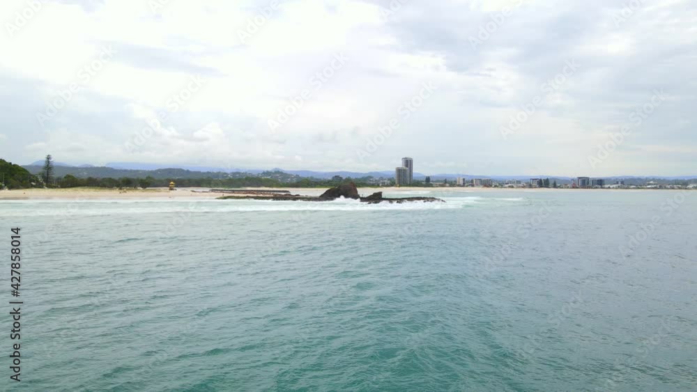 Aerial View Of Currumbin Beach From Blue Sea At Daytime - Seascape At Currumbin, Gold Coast, QLD, Australia. Aerial View Of Currumbin Beach From Blue Sea At Daytime - Seascape At Currumbin, Gold Coast, QLD, Australia.