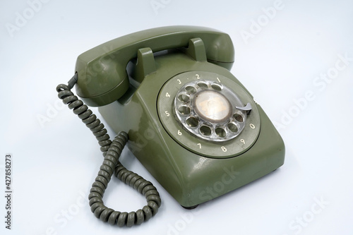 Old and dirty green phone, isolated background