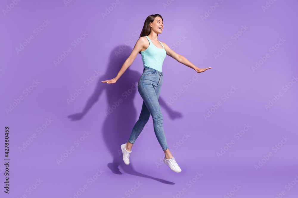 Obraz premium Full size profile side photo of walk jump up air empty space happy sale summer mood isolated on violet color background