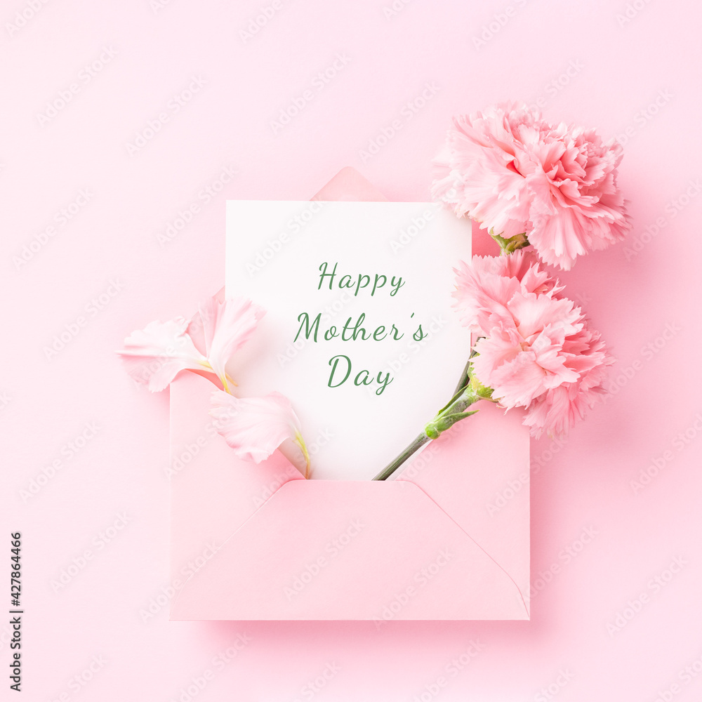 Happy Mother's Day card in pink envelope with carnations on pink background. - obrazy, fototapety, plakaty 
