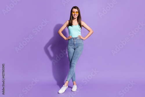 Full size photo of young beautiful positive good mood girl in funky glasses smiling isolated on purple color background