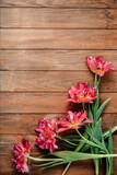 Bouquet of beautiful tulips on a wooden table.