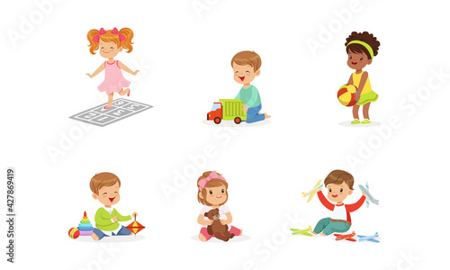 Happy Cute Kids Playing Toys Set, Little Boys and Girls Hugging Teddy Bear, Playing with Ball, Car, Pyramid Cartoon Vector Illustration
