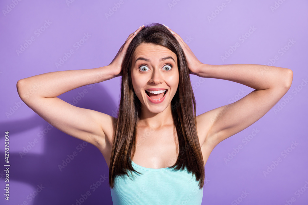 Fototapeta premium Photo of surprised young lady hold hands head unexpected shopping sale isolated on purple color background