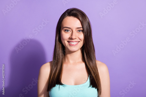 Photo of happy charming nice young woman cheerful smile good mood isolated on purple color background