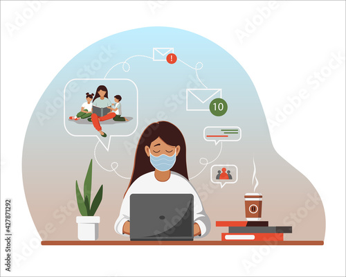 Woman in a medical mask works at the laptop and communicate by video conferencing.	
