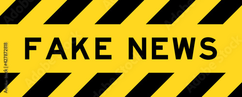 Yellow and black color with line striped label banner with word fake news