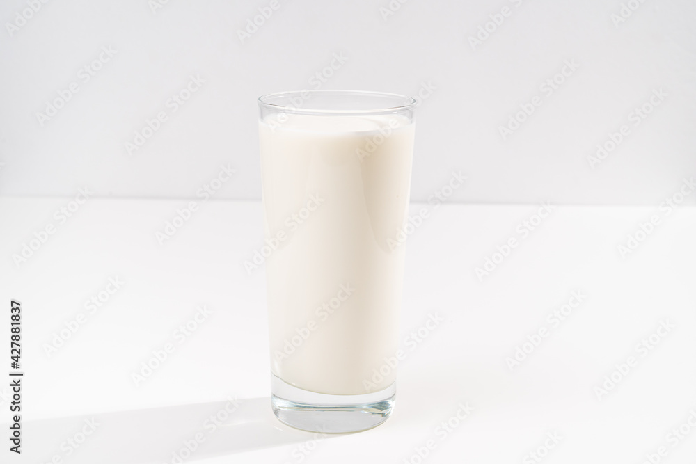 a glass of milk on a white background. selling farm products. Place for the inscription. a glass of milk on a white background. selling farm products. Place for the inscription.