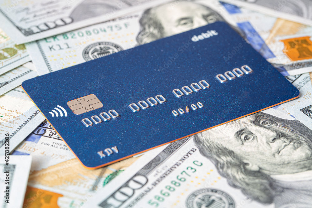 Fototapeta premium Debit card and US 100 dollar banknote