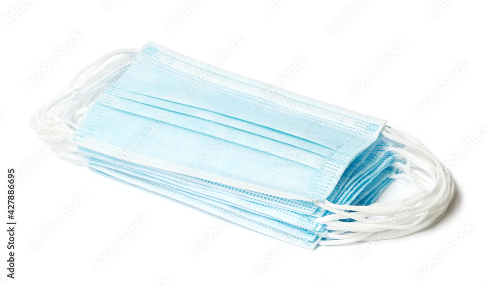 Package of surgical face masks isolated on white background with clipping path. Disposable medical respiratory surgical face masks Package of surgical face masks isolated on white background with clipping path. Disposable medical respiratory surgical face masks