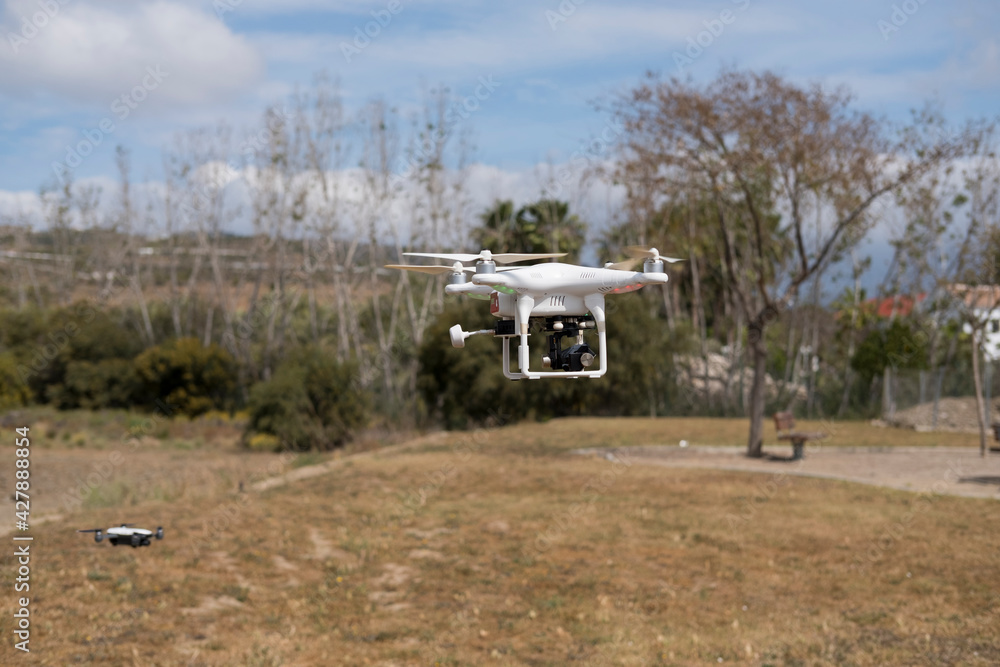 Two drones begin takeoff in a flight practice at an aviation school