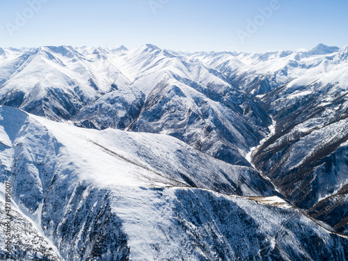 Aerial view of snow covered high altitude mountains in tibet China