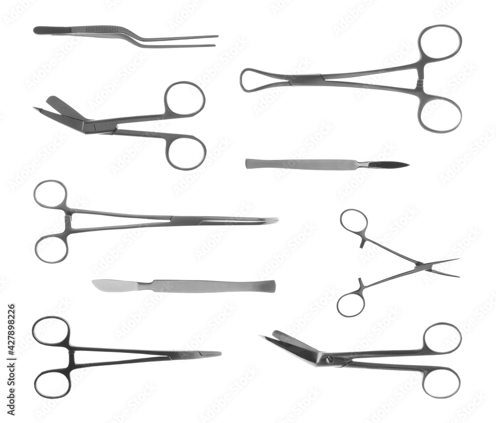 Set with different surgical instruments on white background