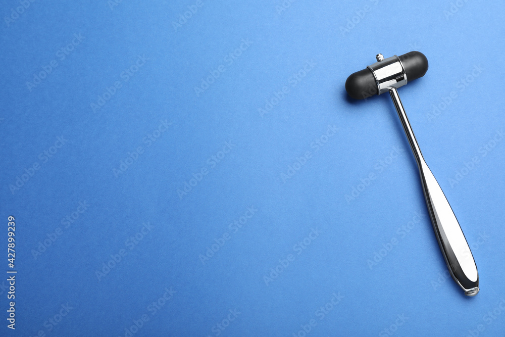 Reflex hammer on blue background, top view with space for text. Nervous system diagnostic Reflex hammer on blue background, top view with space for text. Nervous system diagnostic