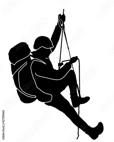 Climber climbs the rope with a backpack