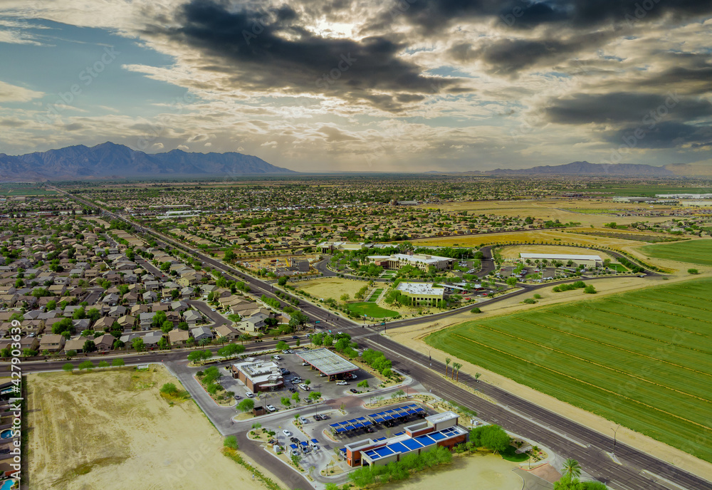 Aerial drone view of small town near mountains area a residential neighborhood with Avondale town Arizona US