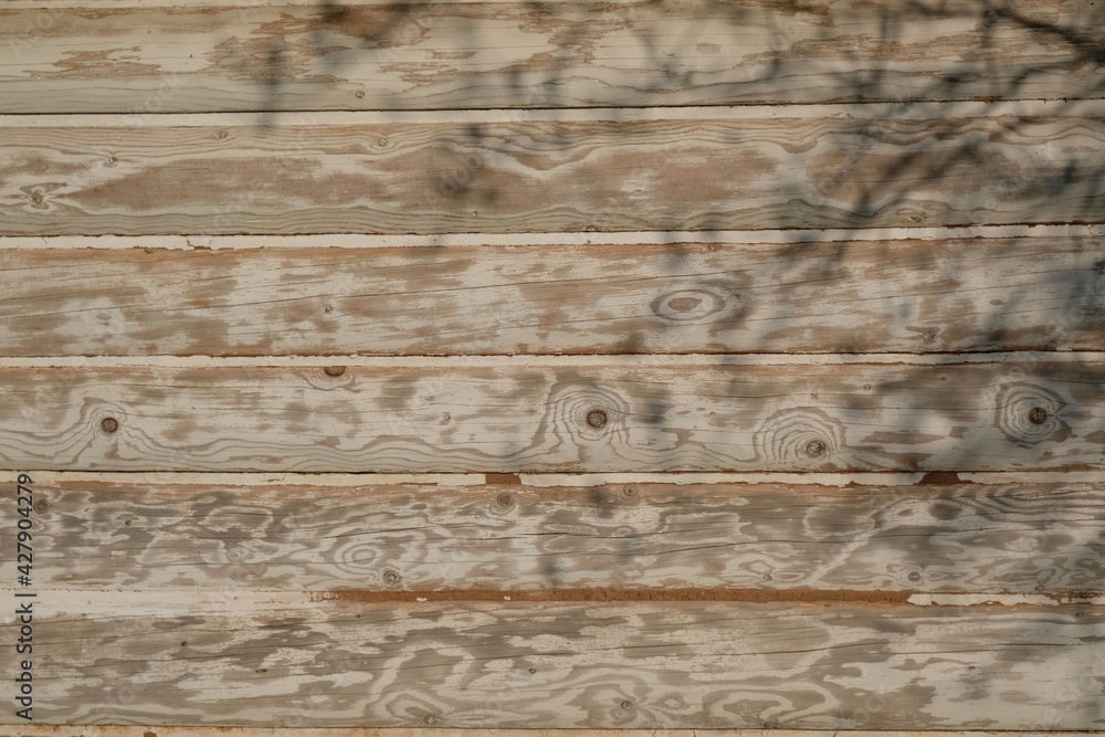 Naklejka premium Closeup of bright planks wall of a country cottage