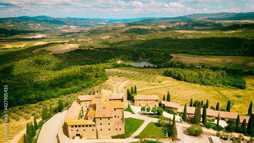 Aerial view of Banfi Castle from drone in Tuscany, spring season photo