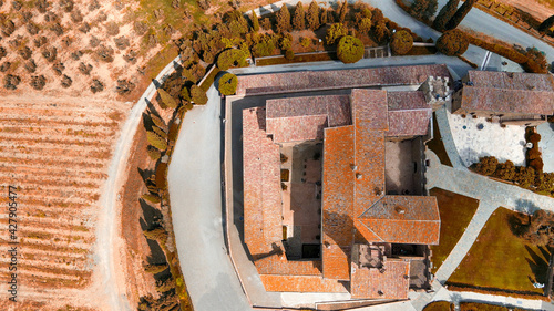 Aerial view of Banfi Castle from drone in Tuscany, spring season