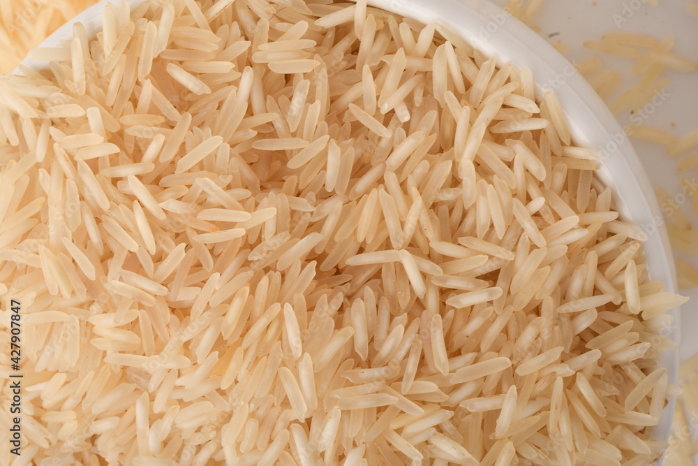 Pile of brown rice isolated on white background. Pile of brown rice isolated on white background.