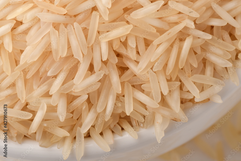 Pile of brown rice isolated on white background. Pile of brown rice isolated on white background.