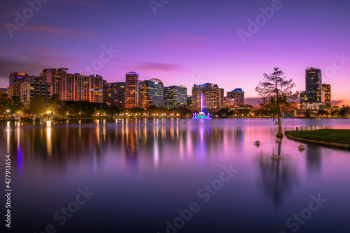 Colorful sunset above Lake Eola and city skyline in Orlando, Florida photo