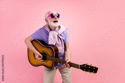 Canvastavla Photo portrait of funky happy grandpa playing guitar wearing star sunglass isola