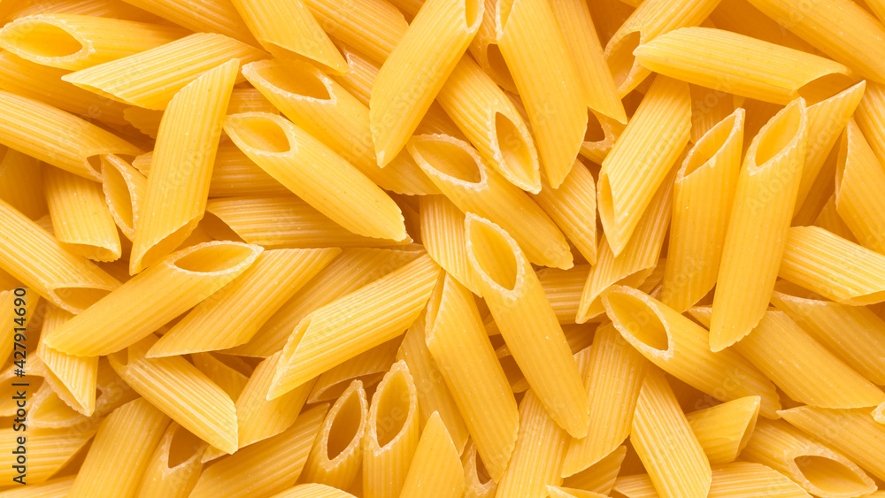 Pasta Penne food background. Italian food. Top view. Pasta Penne food background. Italian food. Top view.