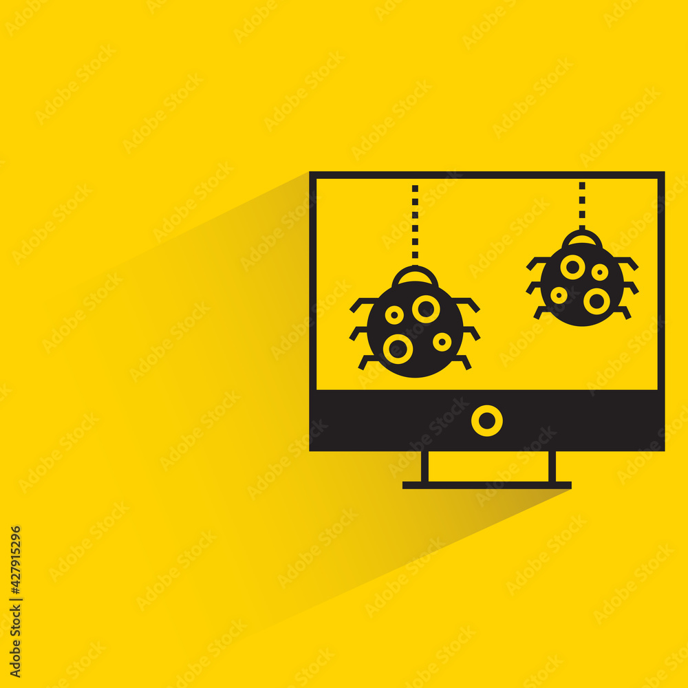 bug malware on desktop computer with shadow on yellow background bug malware on desktop computer with shadow on yellow background