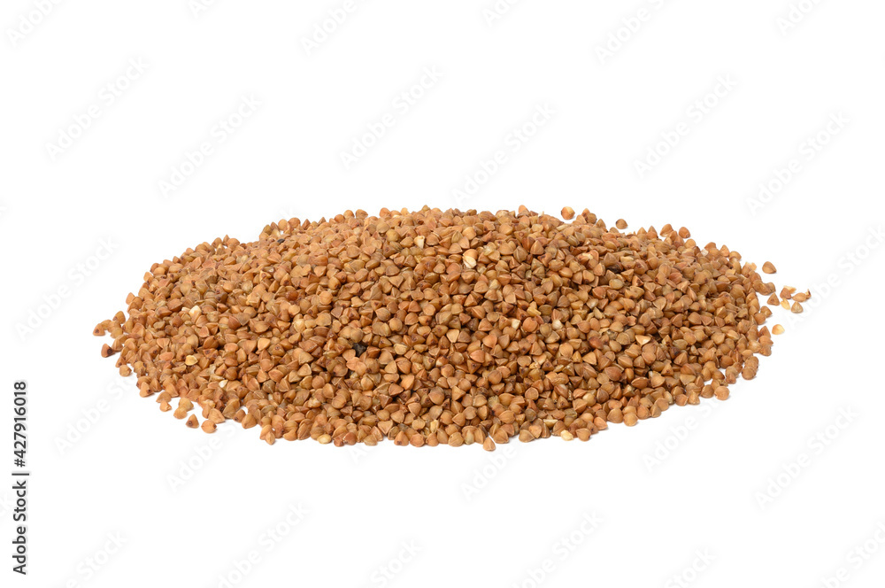 heap of uncooked buckwheat grains heap of uncooked buckwheat grains