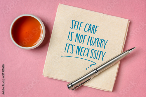 self care is not luxury, it is necessity inspirational reminder - handwriting and doodle on a napkin, lifestyle and health concept photo