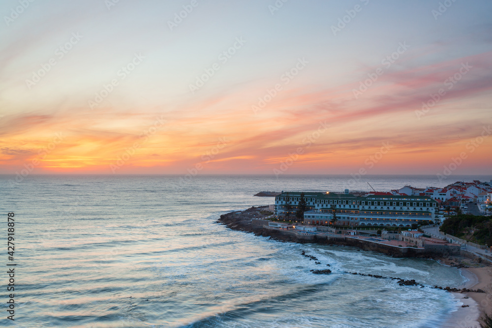 Viewpoint with panoramic landscape of the picturesque village of Ericeira at sunset. Close to Lisbon this fishing village is an amazing holiday destination for many tourists.